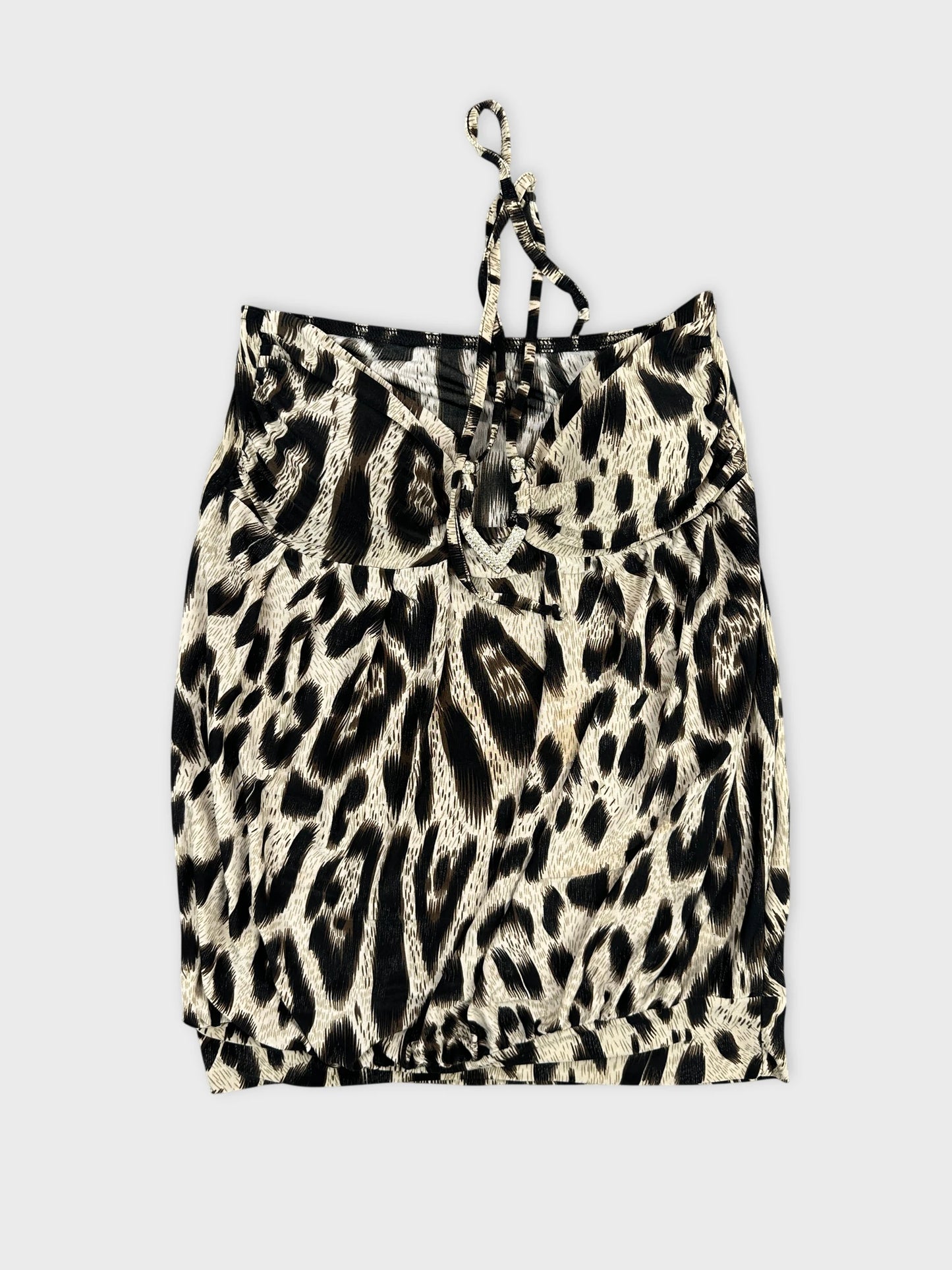 Back view of a women's leopard print top with adjustable straps.
