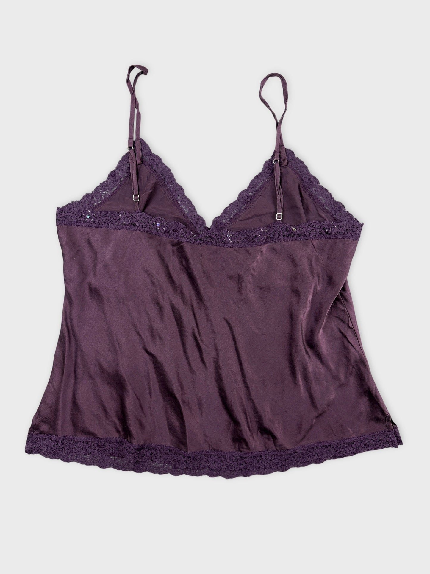 Back view of a purple vintage camisole with lace trim details.