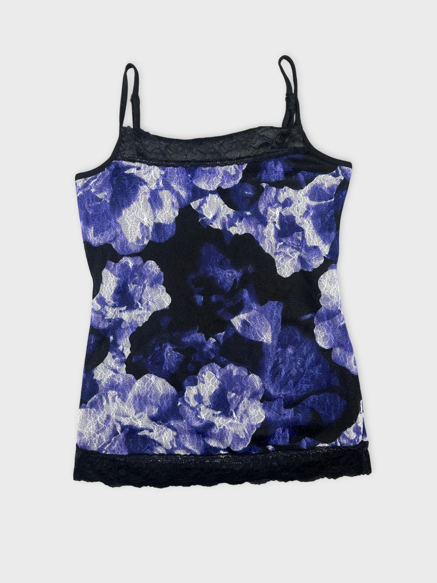 Back view of a floral print tank top in blue and black with lace trim.