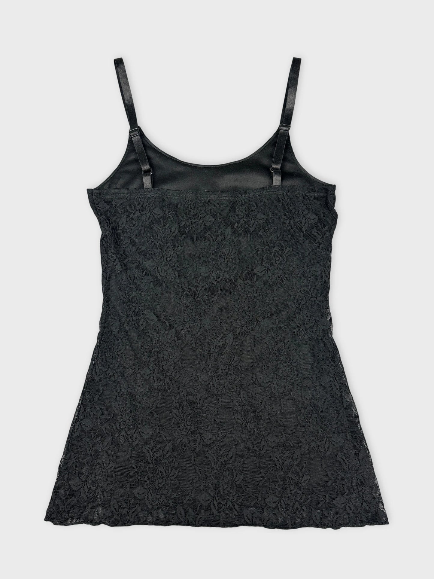 Back view of a black lace women's top with adjustable straps.