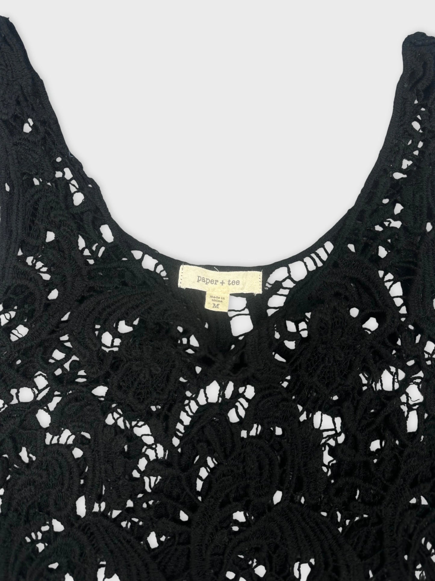 Black lace top with intricate floral pattern detail view