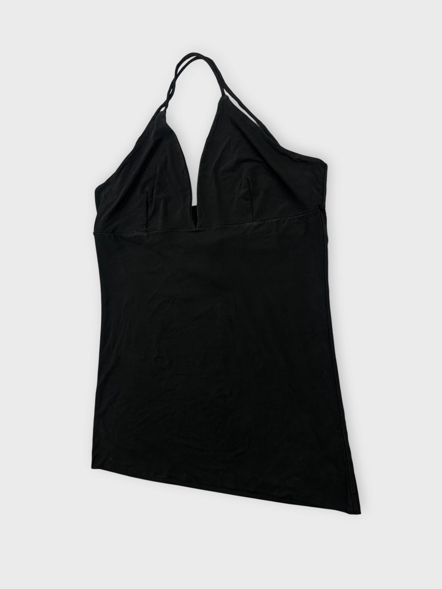 Black halter top with a deep v-neck in detail view