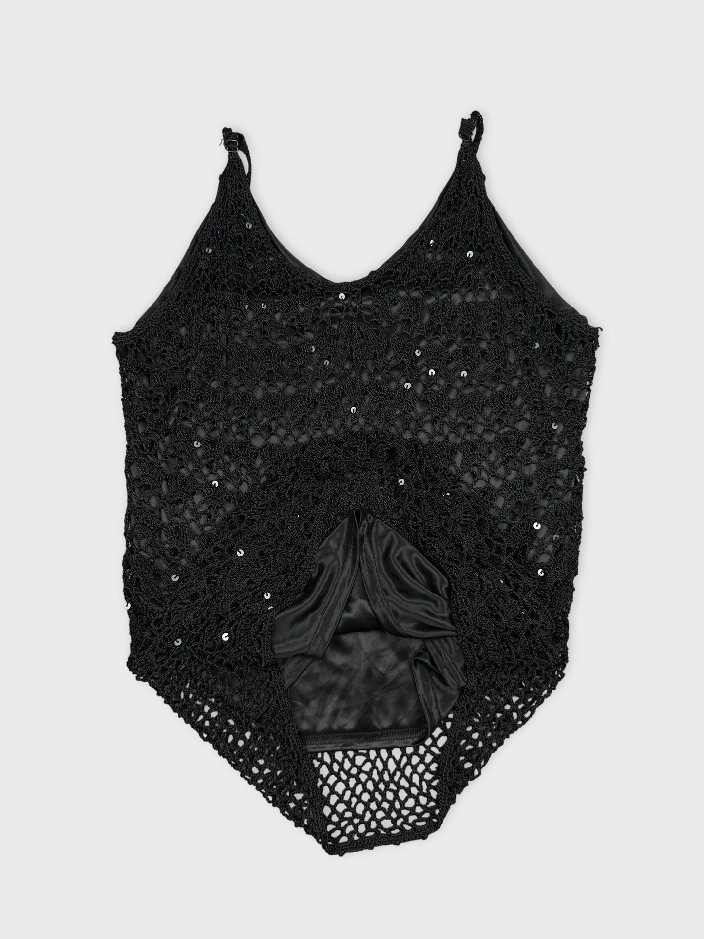 detail view of a black crochet top with sequins