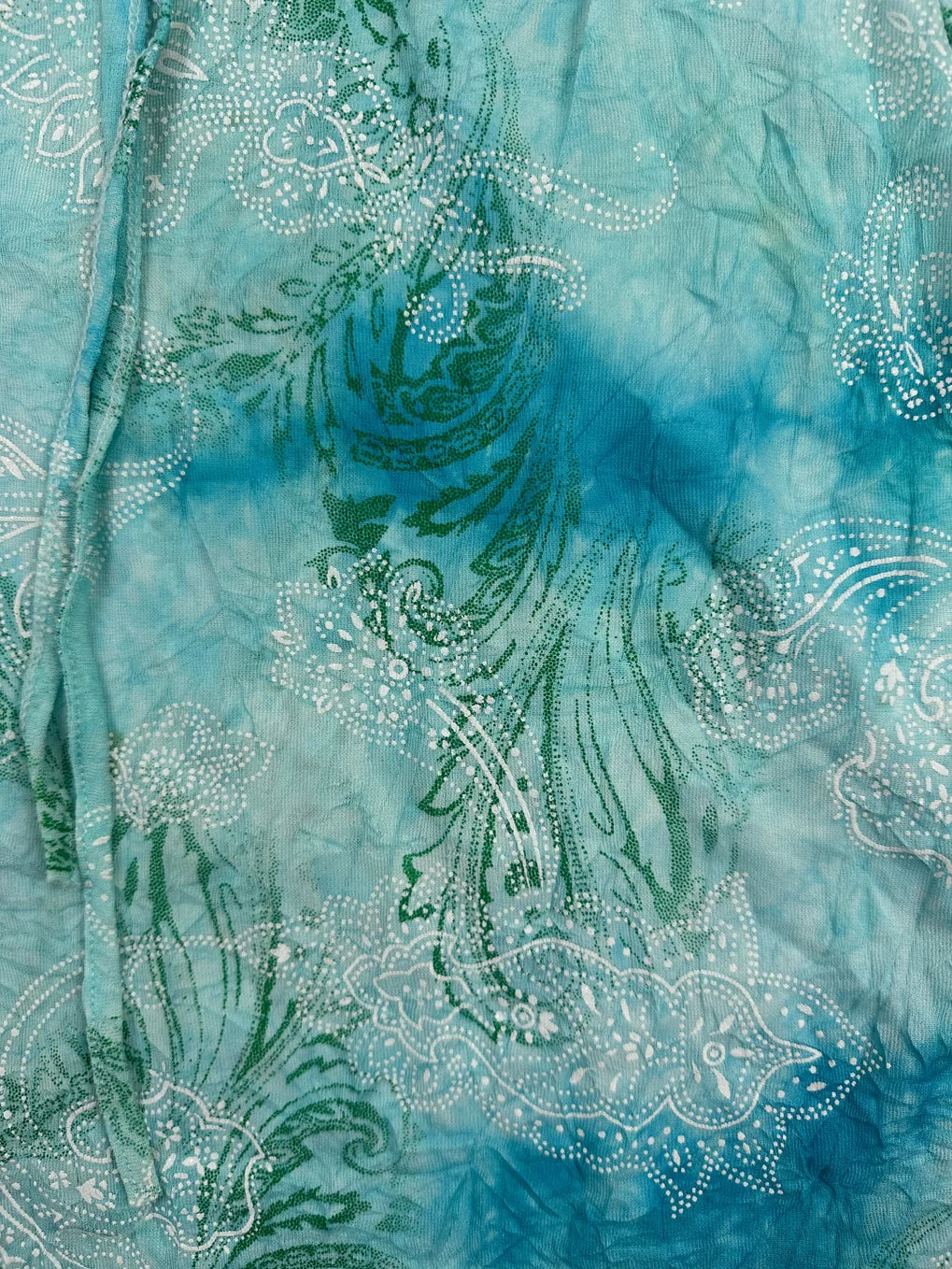Detail view of a light blue vintage top with paisley print.