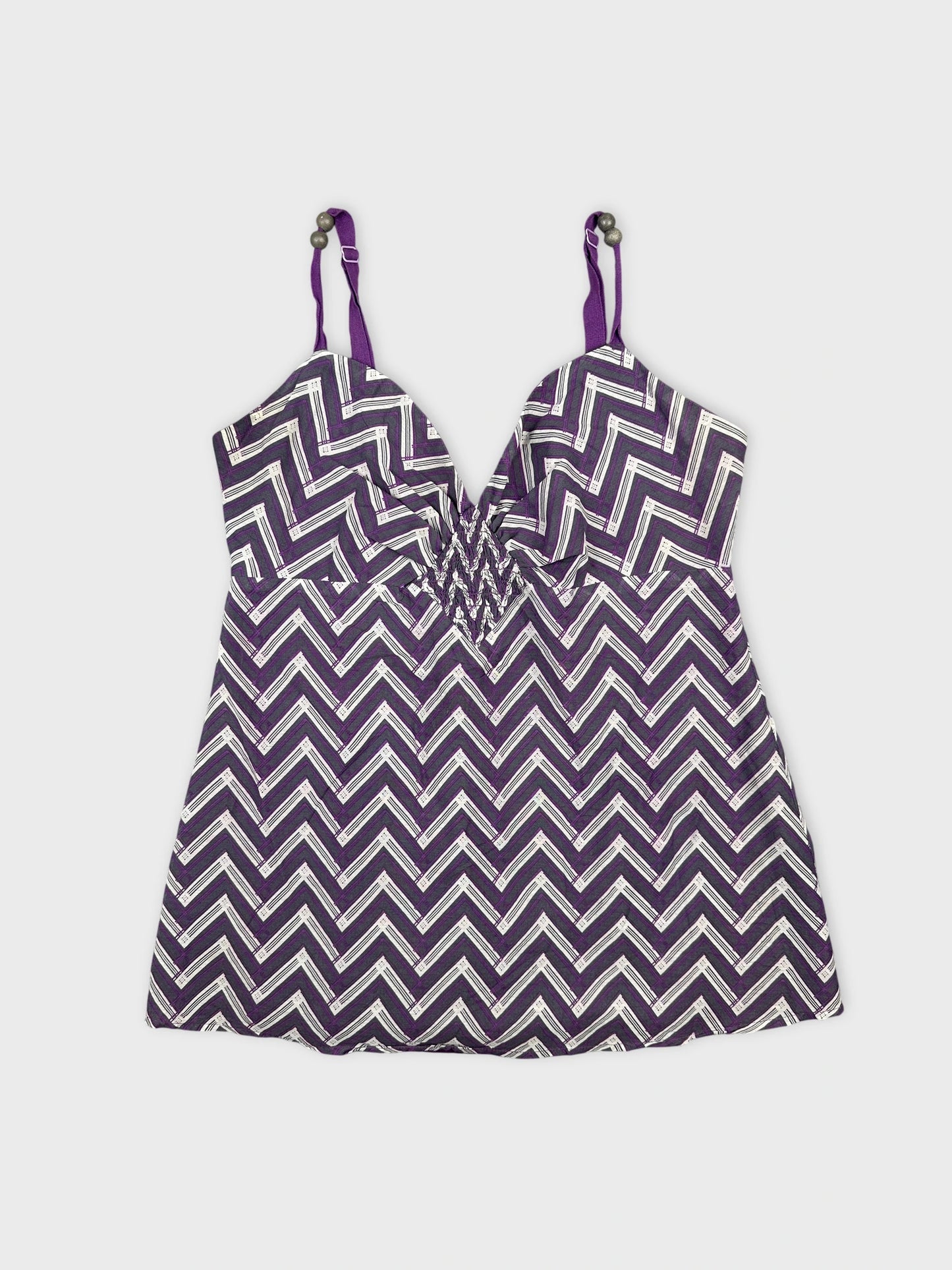 Detail view of a purple chevron-patterned women’s top with thin straps.