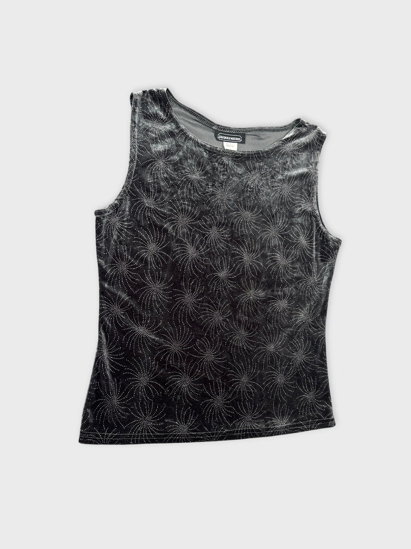 Detail view of a black sleeveless top with spiral pattern