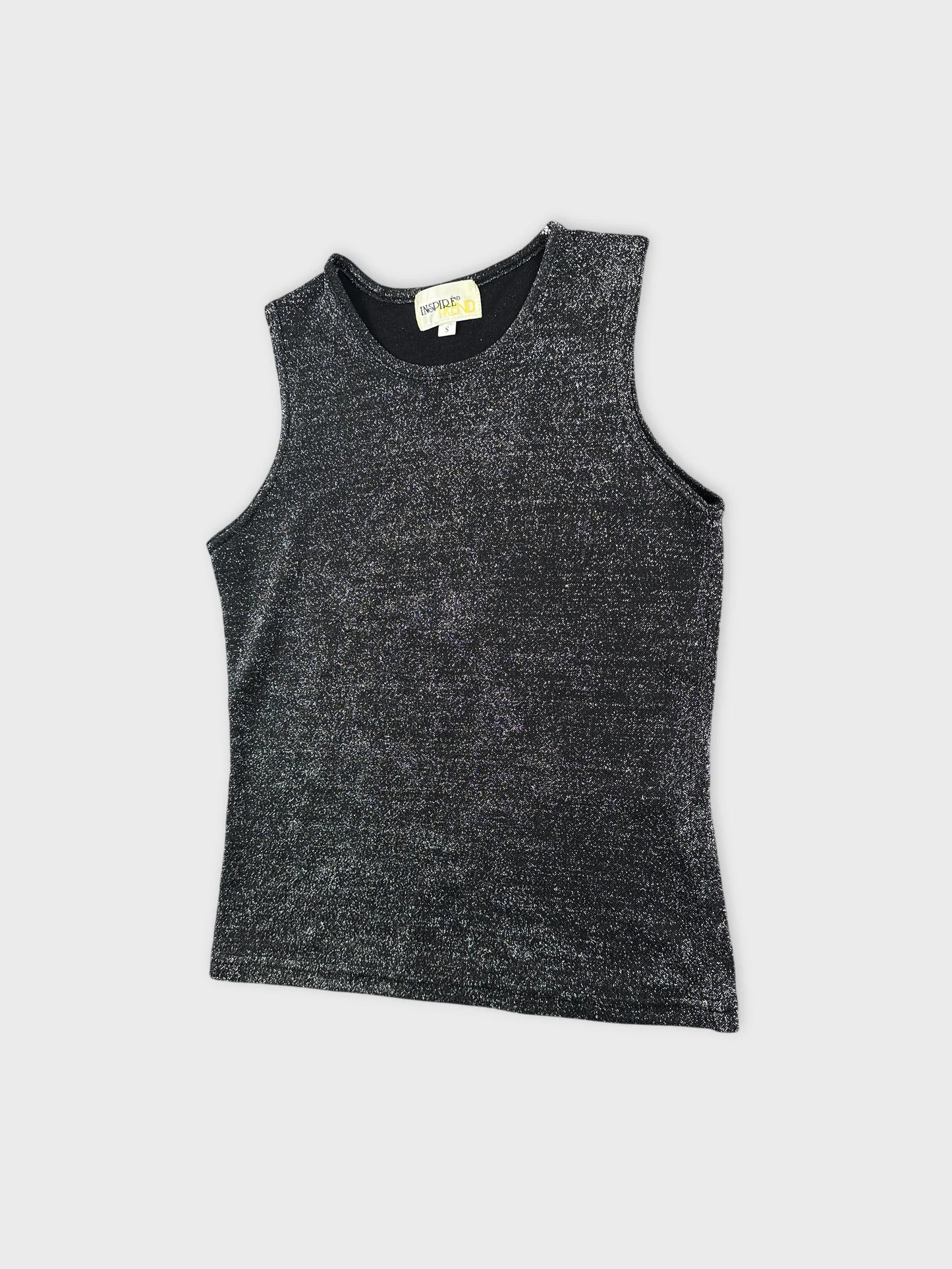 Detail view of a black sleeveless top with a shimmering texture.