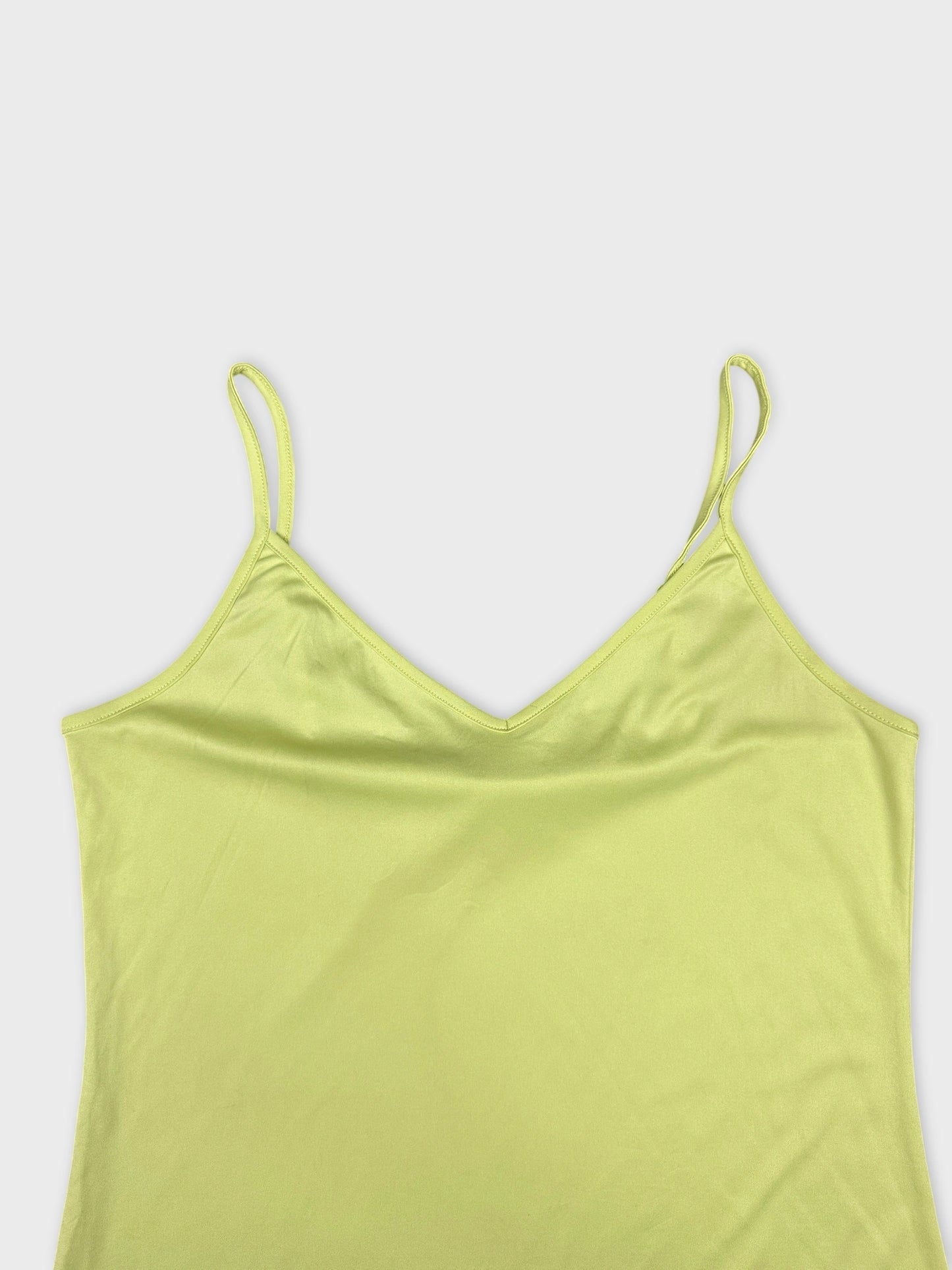 detail view of a yellow camisole with thin straps and a v-neck design