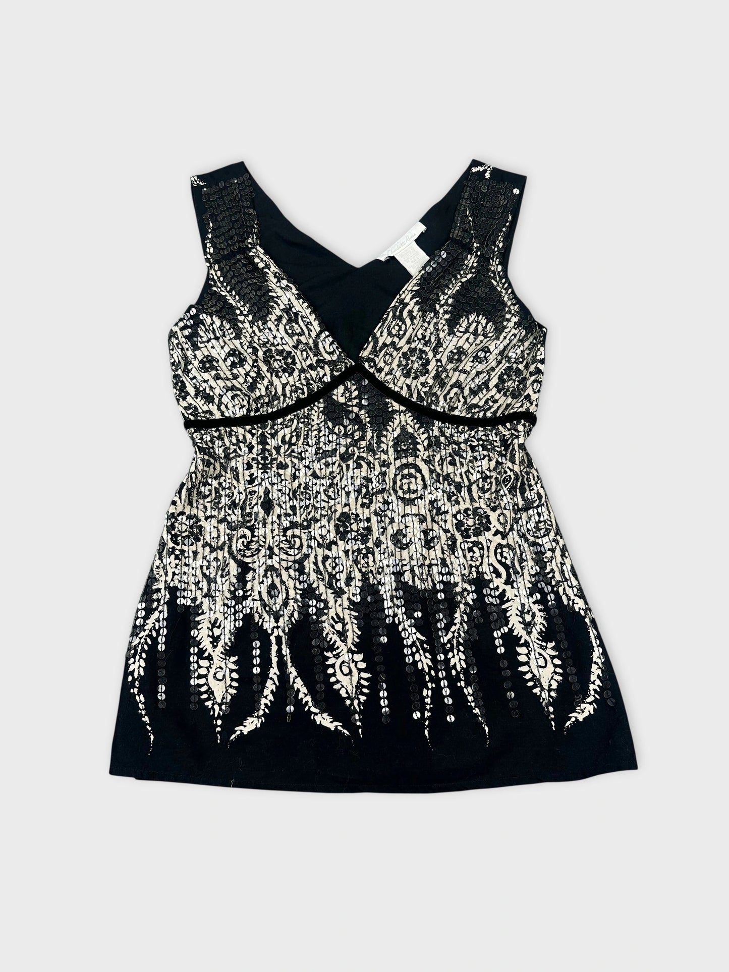 Front view of a black and white embellished tank top with lace pattern.