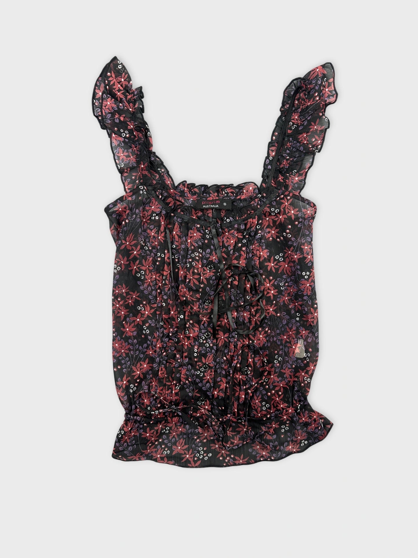 Front view of a floral vintage top with ruffled straps.
