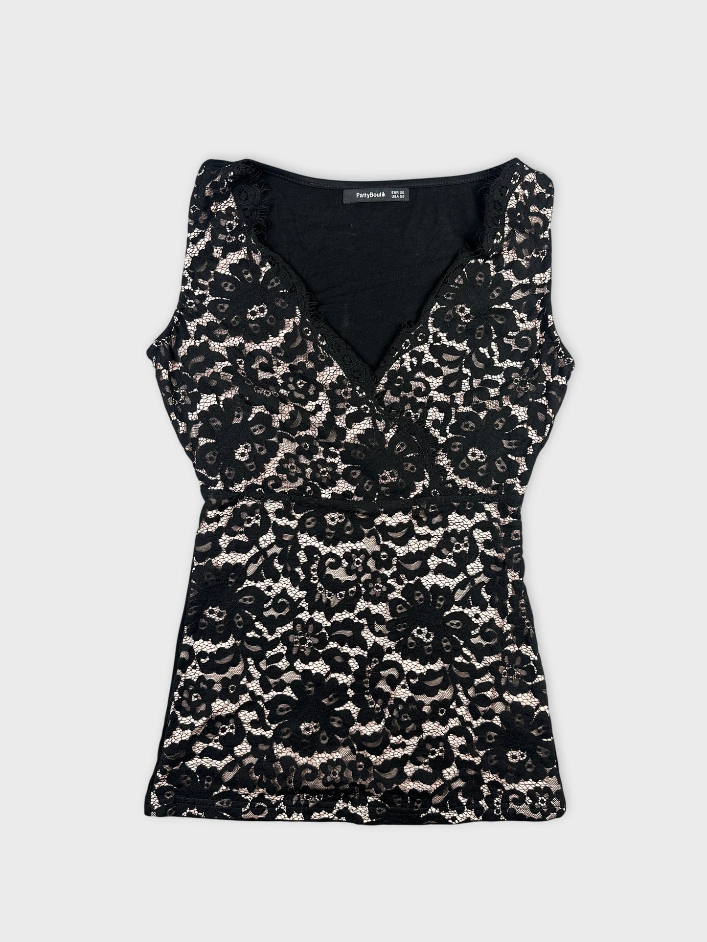 Black lace top with floral pattern front view.
