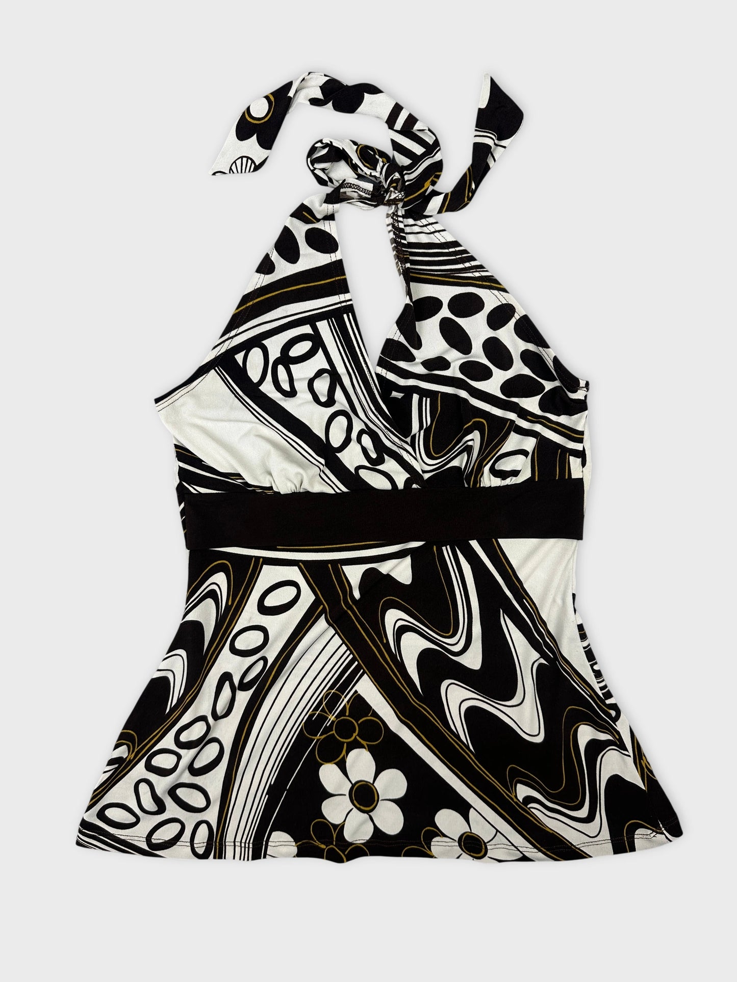 Front view of a halter neck top in black and white with floral patterns.