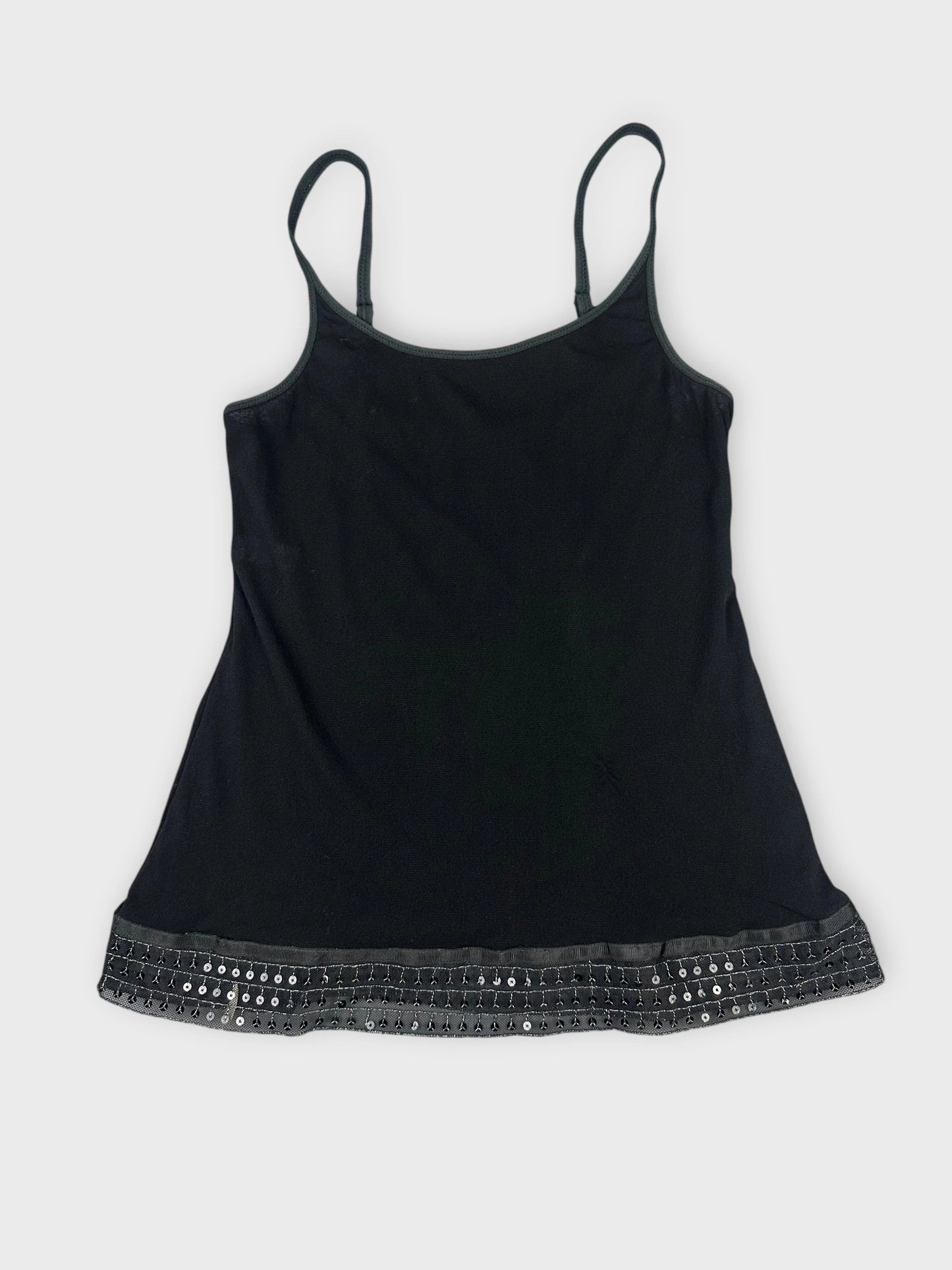 Black tank top front view with decorative trim at the hem.