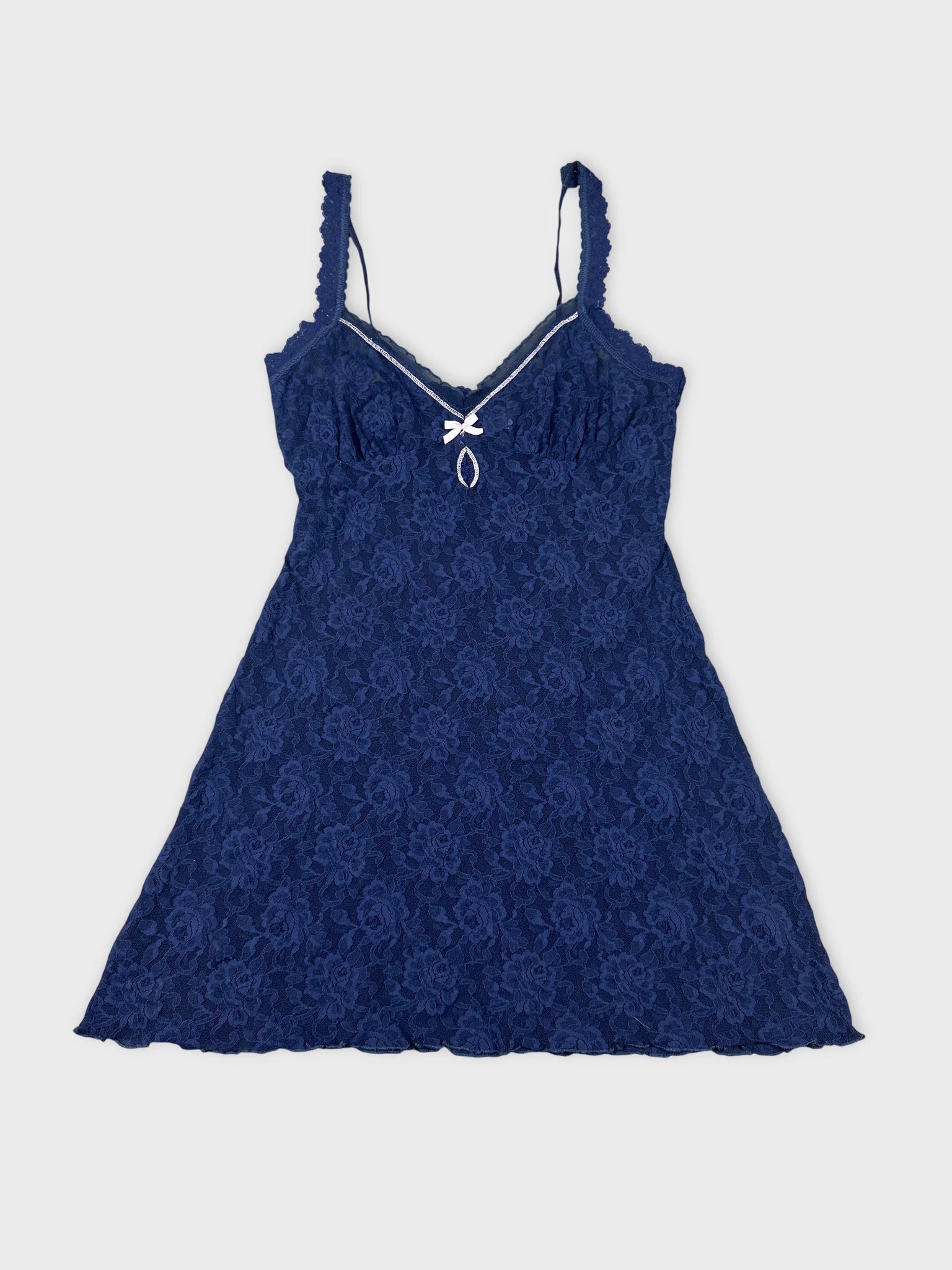 Navy lace top with a bow detail front view.