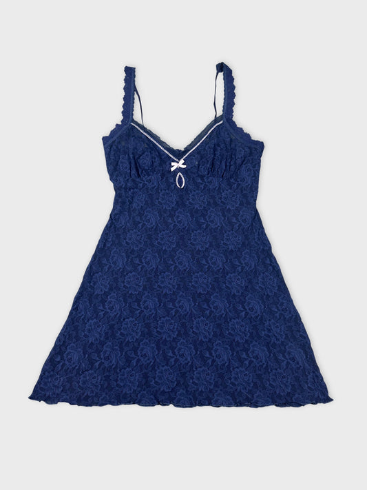 Navy lace top with a bow detail front view.