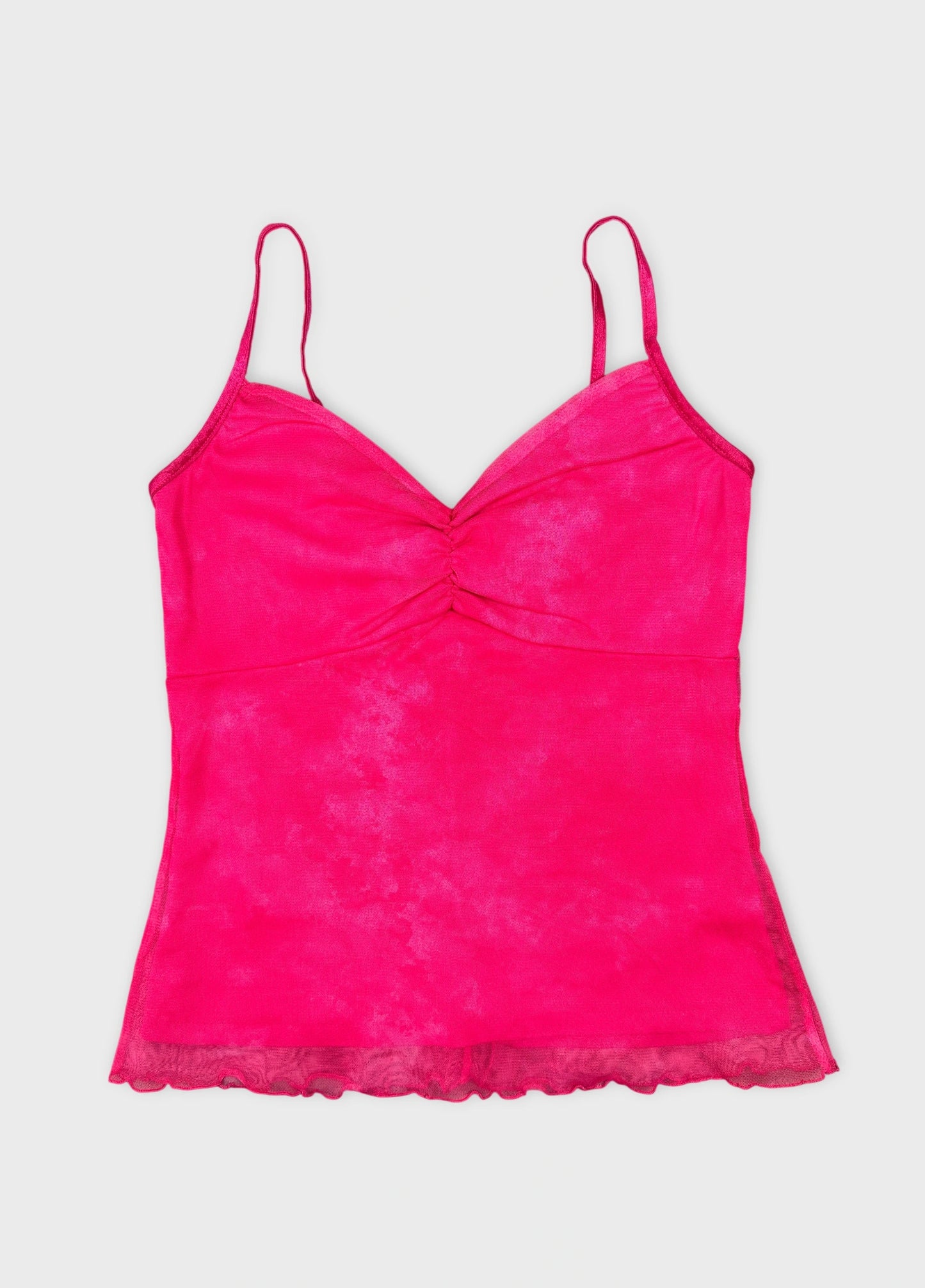 Front view of a hot pink top with a gathered bodice and lace trim.