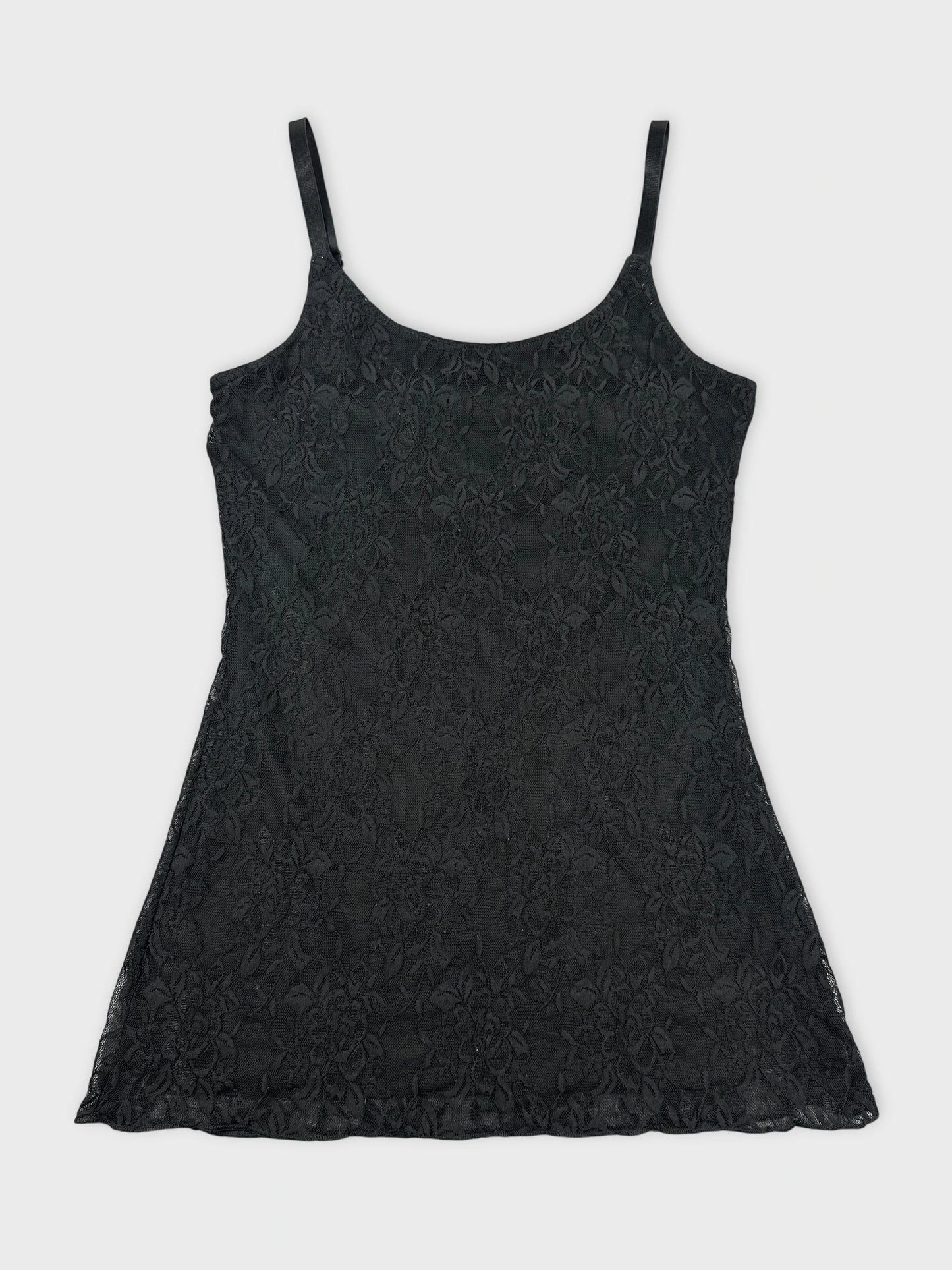 Black lace top with thin straps front view showing floral pattern.