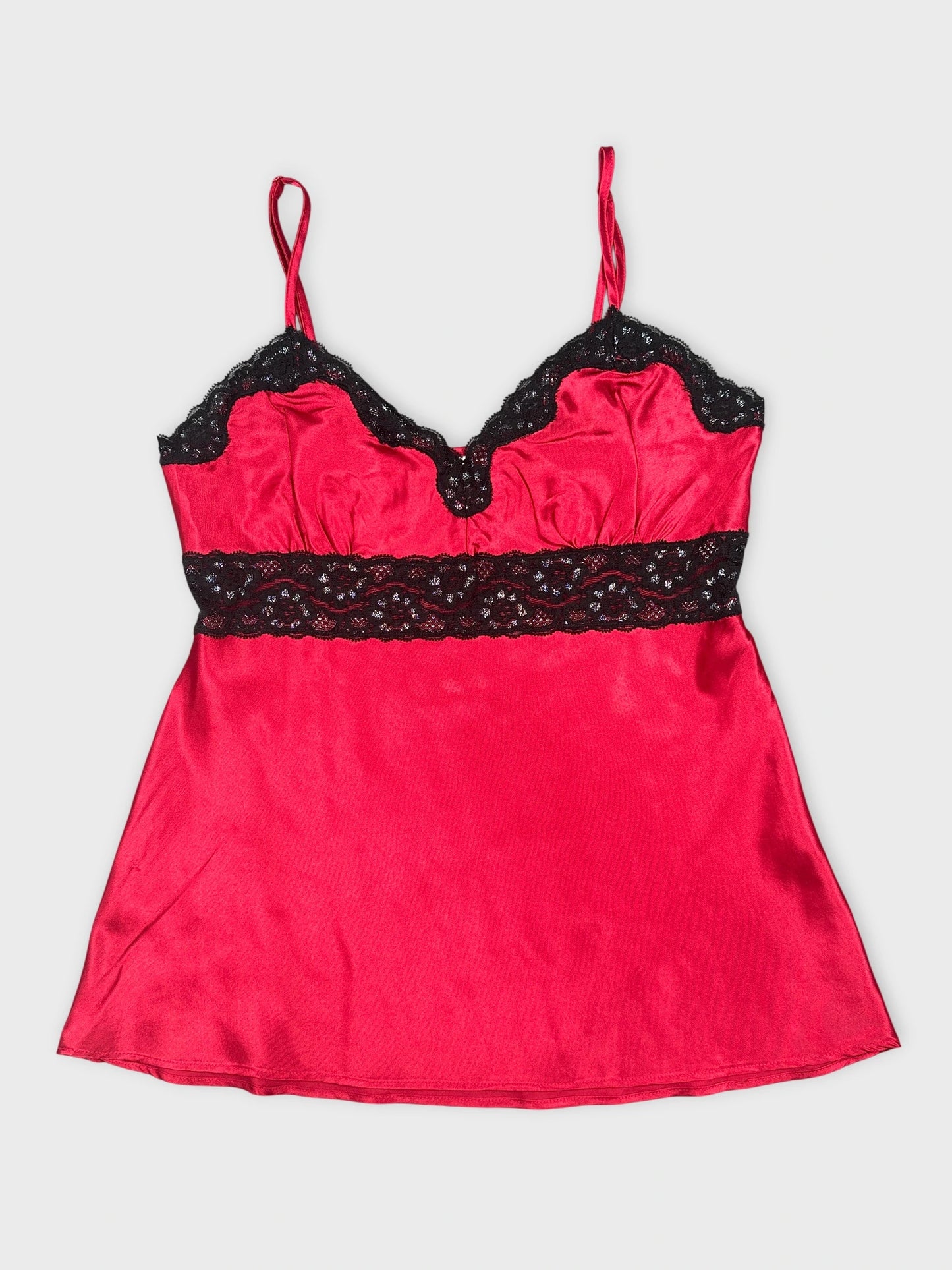 Front view of a red satin top with black lace trim