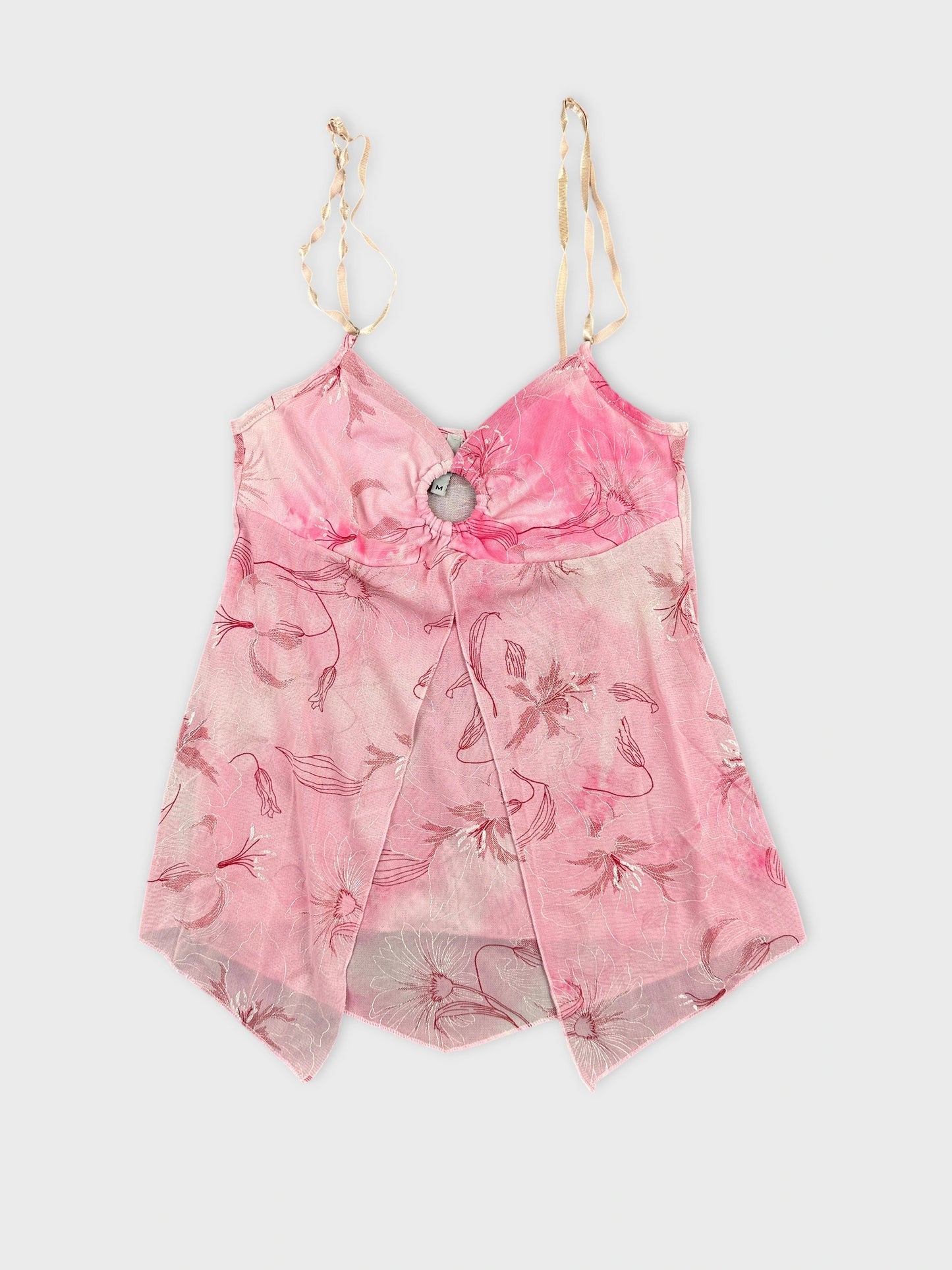 Pink floral patterned women’s top with a tie-back detail front view