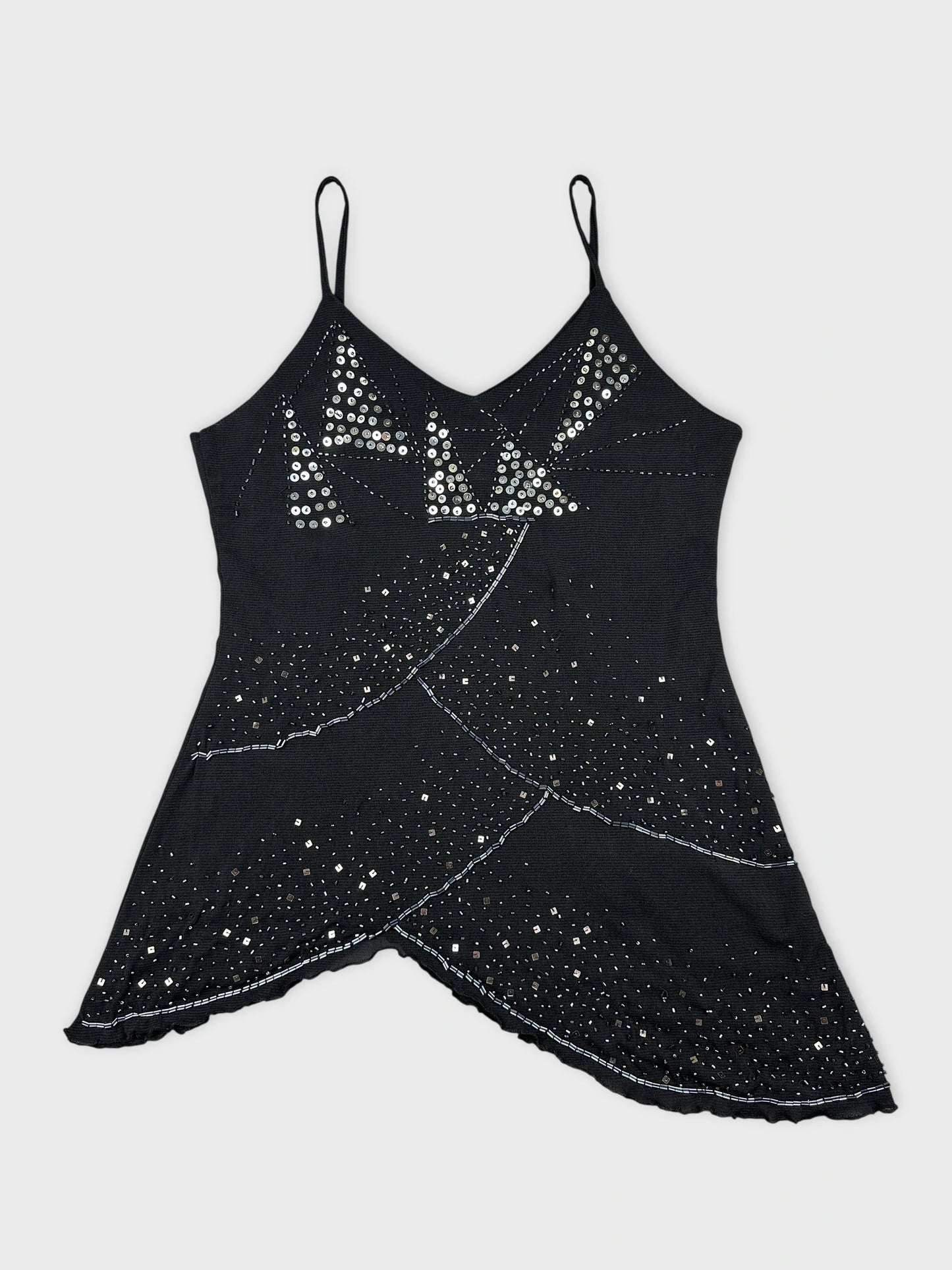 Front view of a black sleeveless top with silver sequins and a scalloped hem.