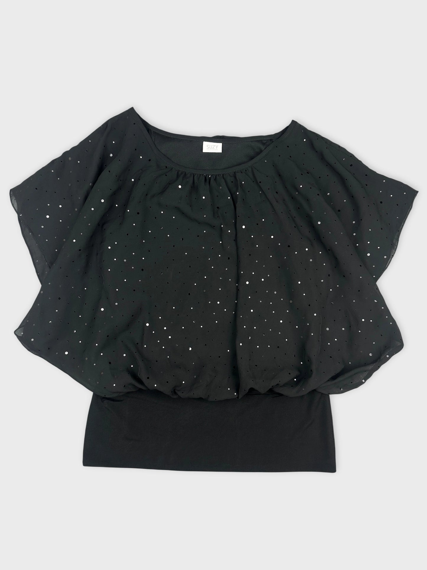 Front view of a black batwing top with silver polka dots.