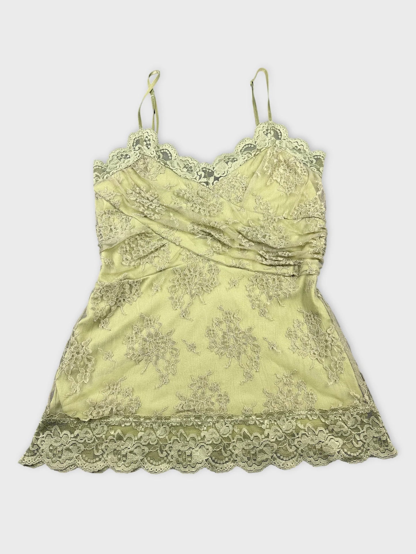 Front view of a pale green lace-trimmed camisole with floral pattern.