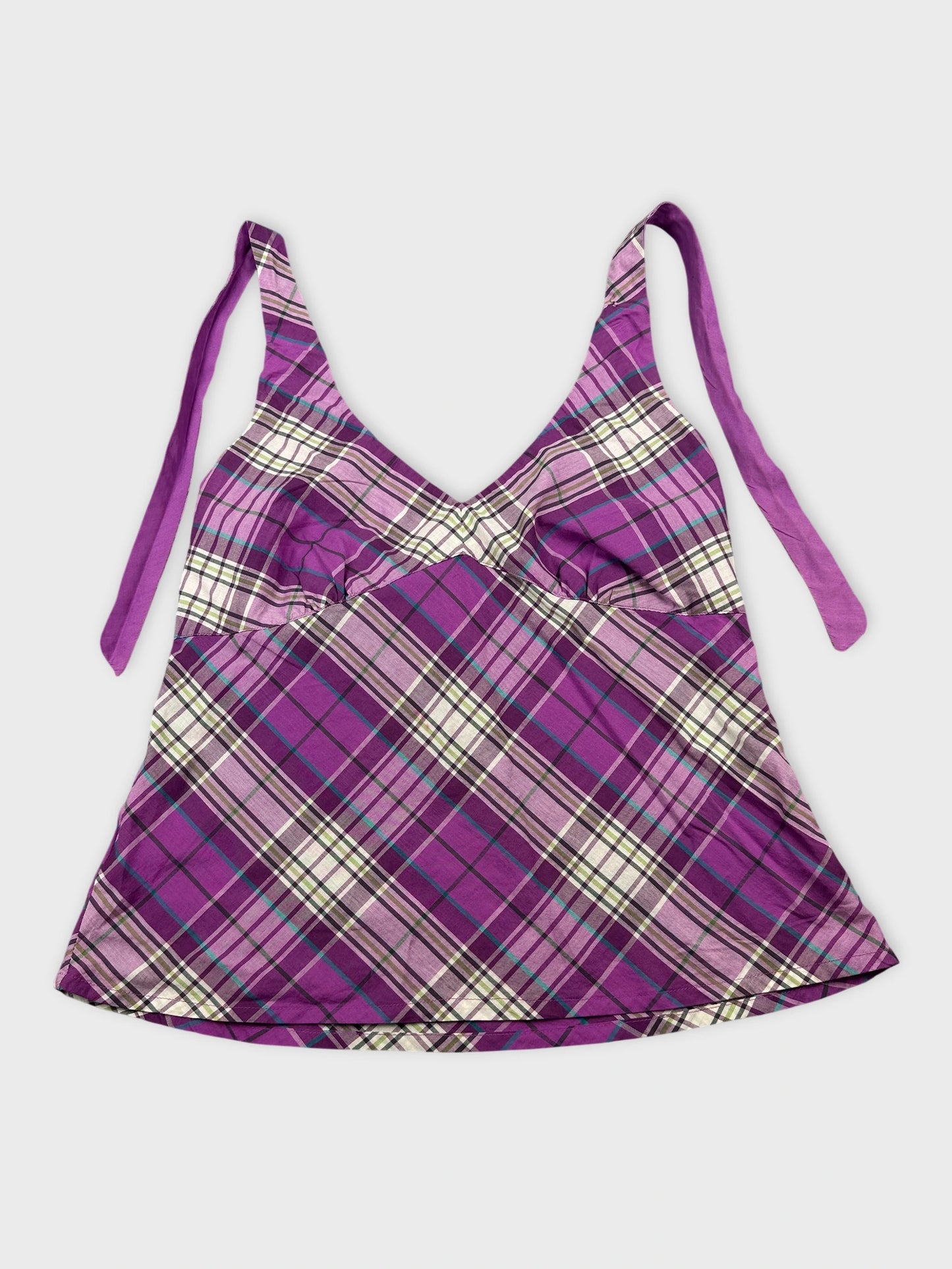 Front view of a purple plaid women's top with adjustable straps.