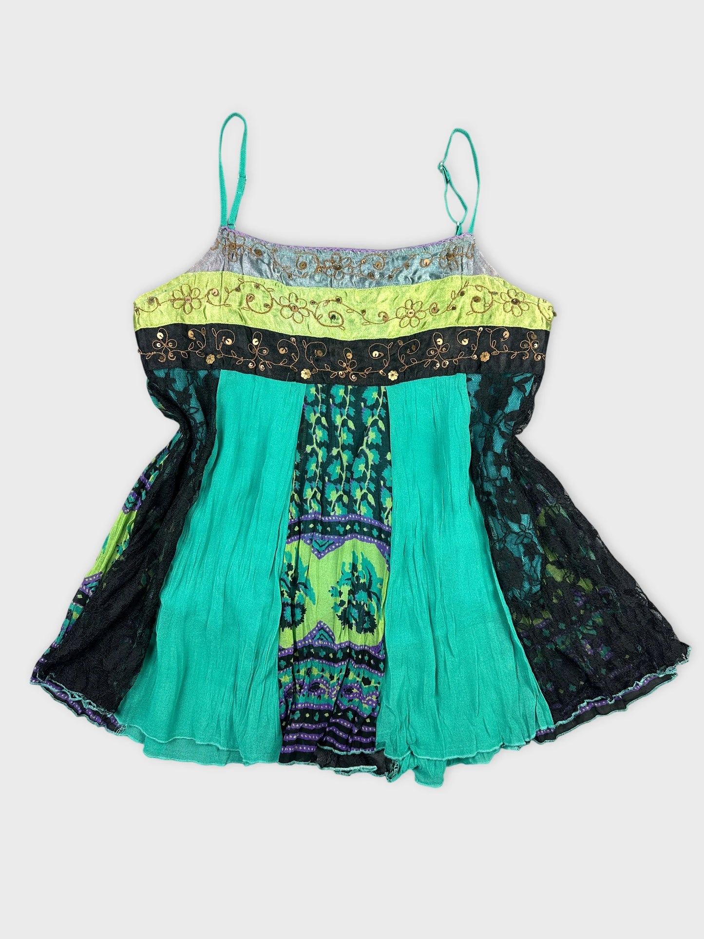 Front view of a multicolored women’s top with a floral trim and black lace.