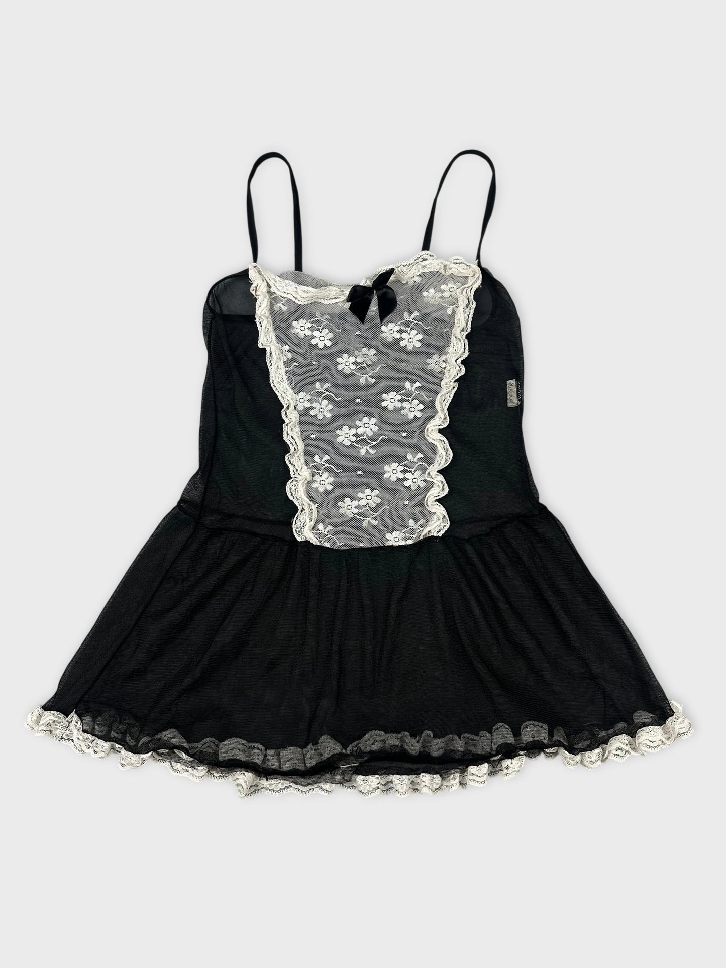 Black vintage top with white lace trim and floral print front view.