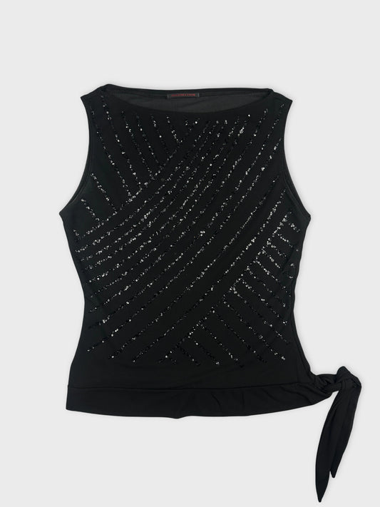 Front view of a black tank top with diagonal sequin detailing and side tie.