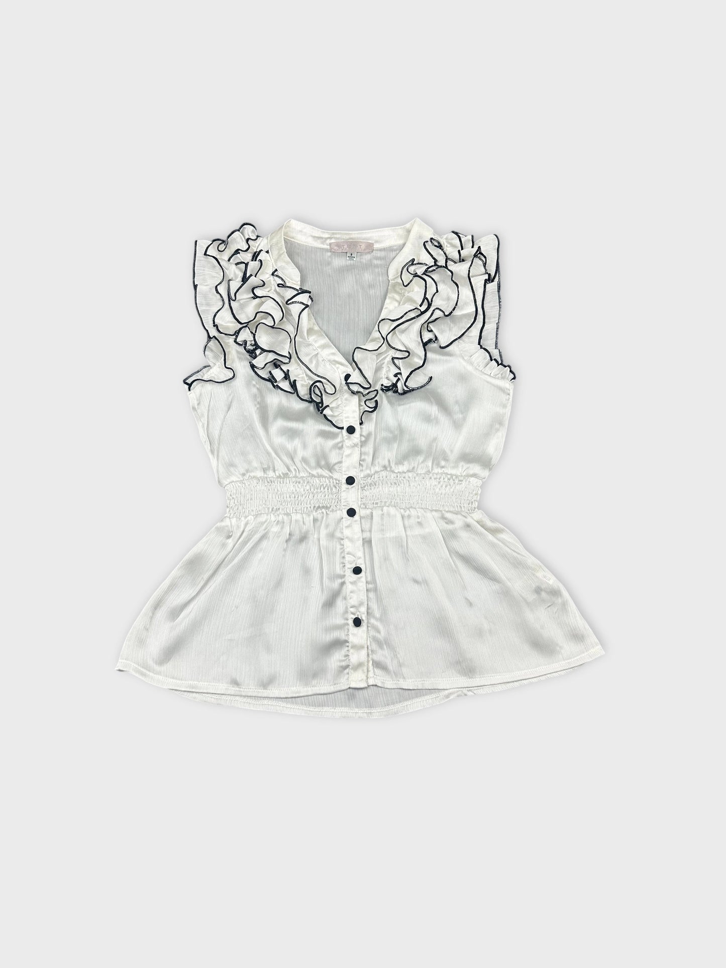 Front view of a white ruffled blouse with a button-up design.
