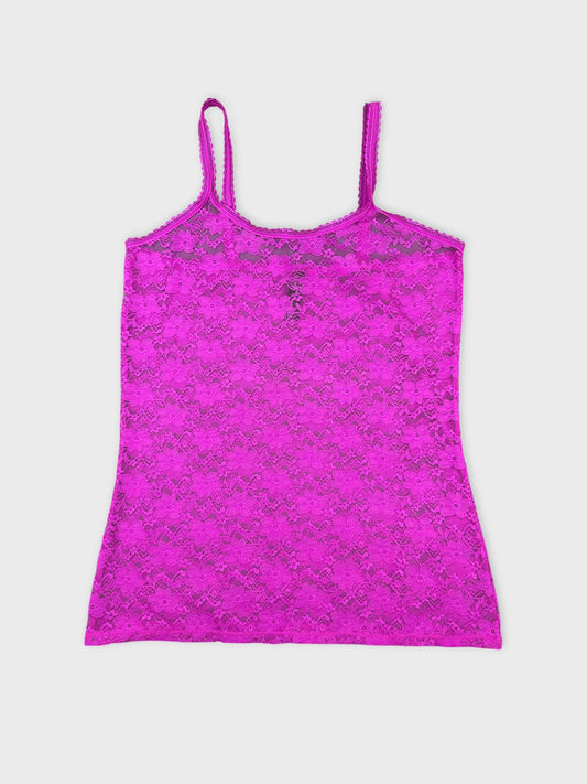 Front view of a pink lace camisole top with thin straps.