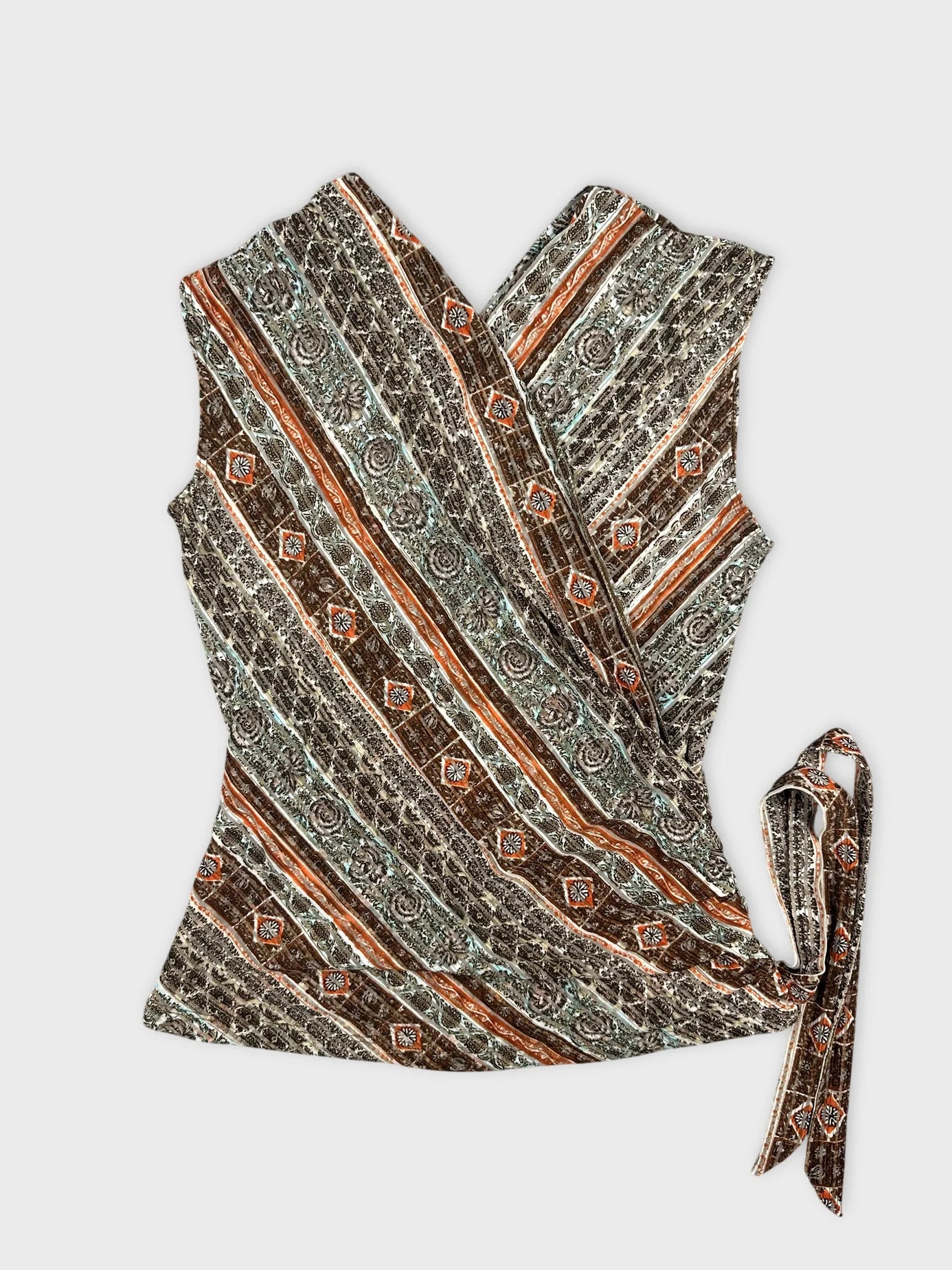 Front view of a vintage top featuring a brown and teal striped pattern with tie detail.