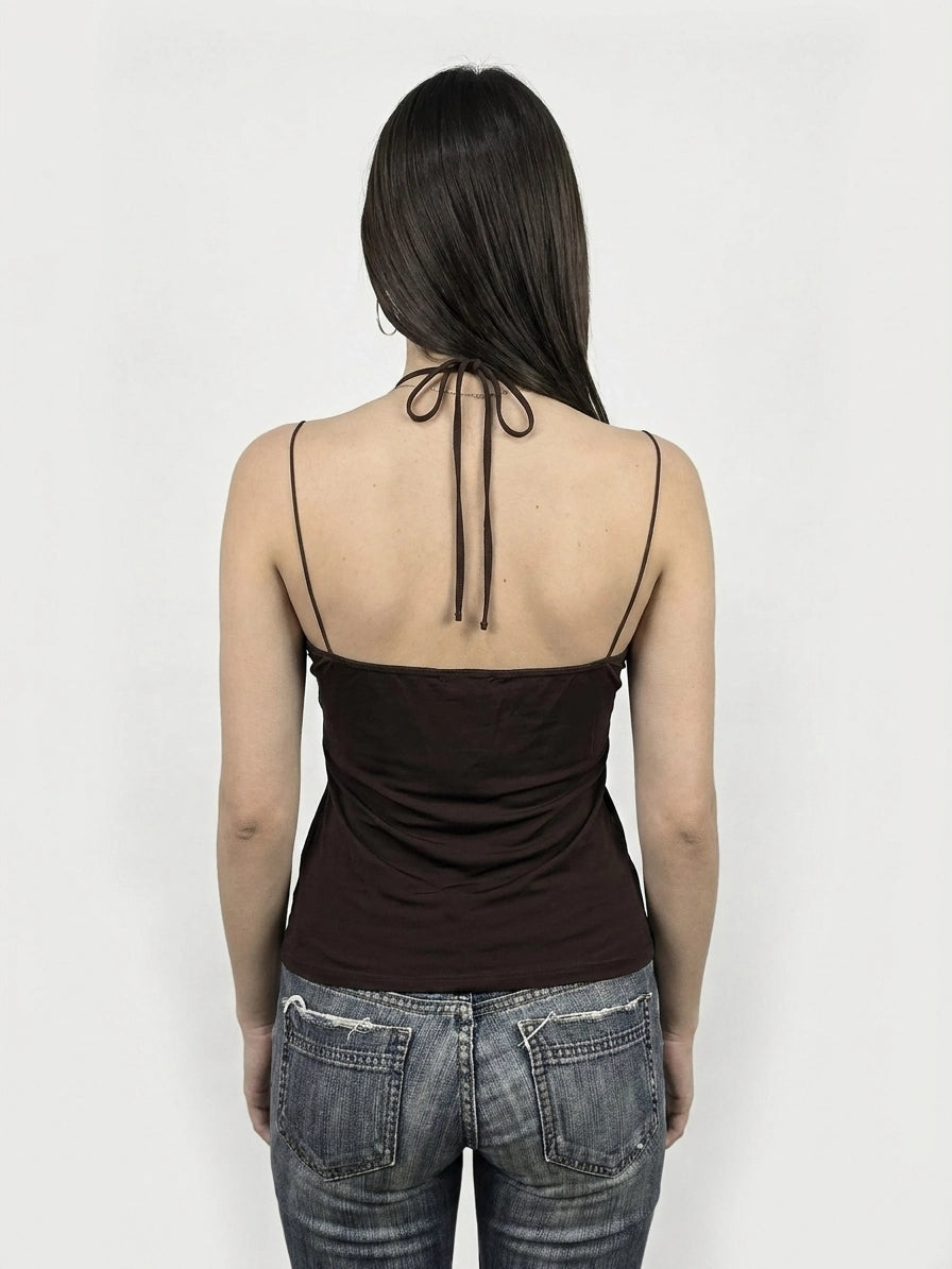 Back view of a brown sleeveless top with tied straps.