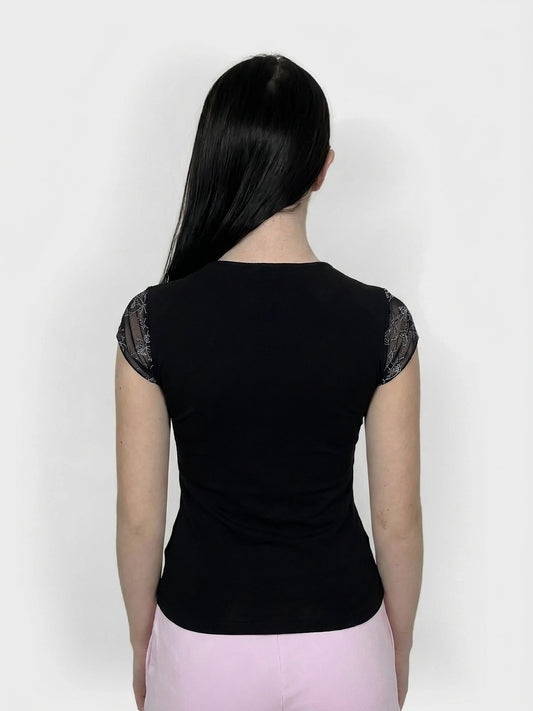 Black upper body top with lace trim, seen from the back view.