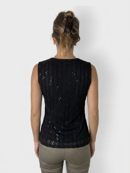 Back view of a black sleeveless top featuring a textured, sequined design.