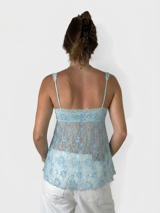Back view of a light blue lace top with adjustable straps.