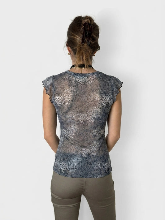 Back view of a blue patterned upper body top with ruffled sleeves.