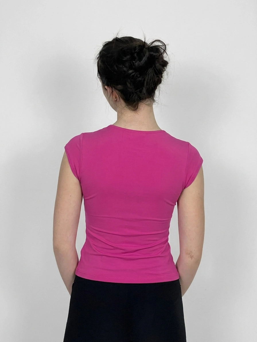 Back view of a fitted pink women's top with short sleeves.