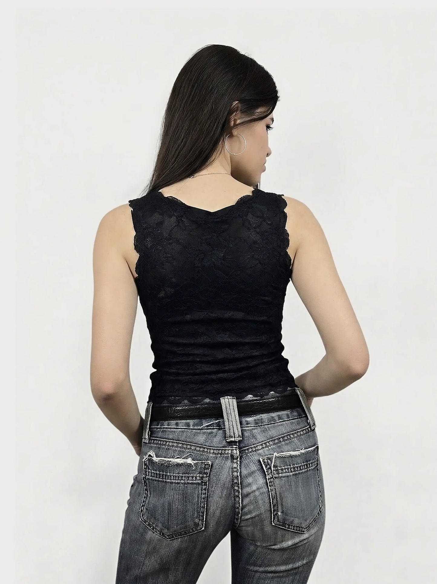Back view of a black lace women's tank top featuring scalloped edges.