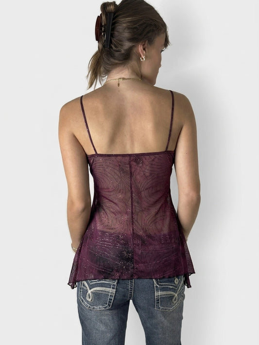 Back view of a purple upper body top with a sheer floral pattern.