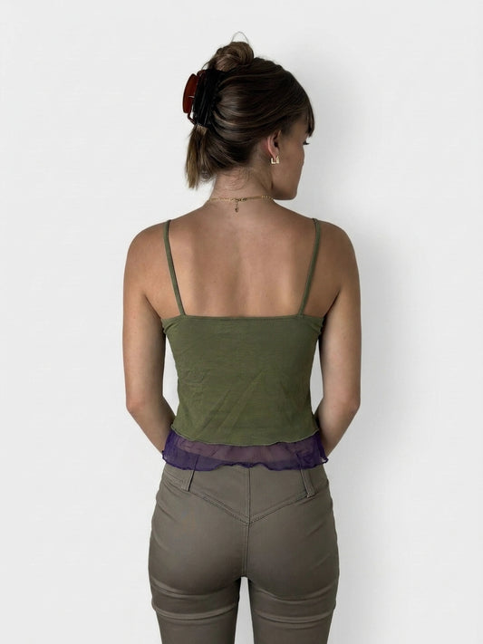Back view of a green upper body top with purple lace trim.