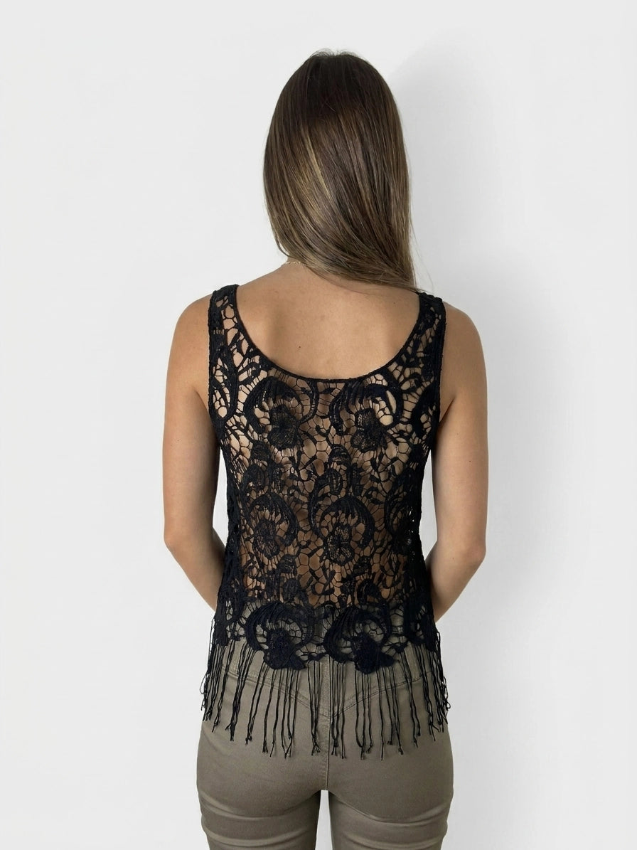 Back view of a black lace sleeveless top with fringe detail.
