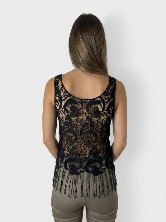 Back view of a black lace sleeveless top with fringe detail.