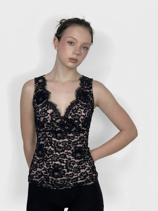 Black lace women's top with floral pattern, front view.