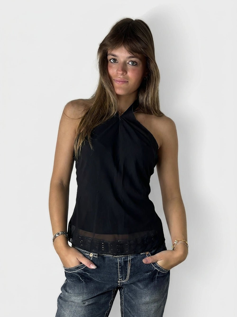 Black halter top with a sheer hem, front view.