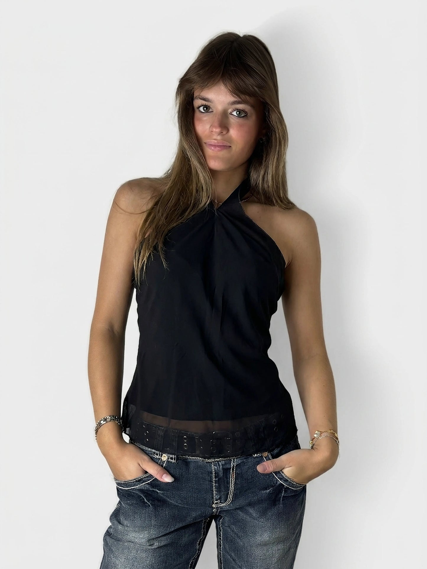 Black halter top with a sheer hem, front view.