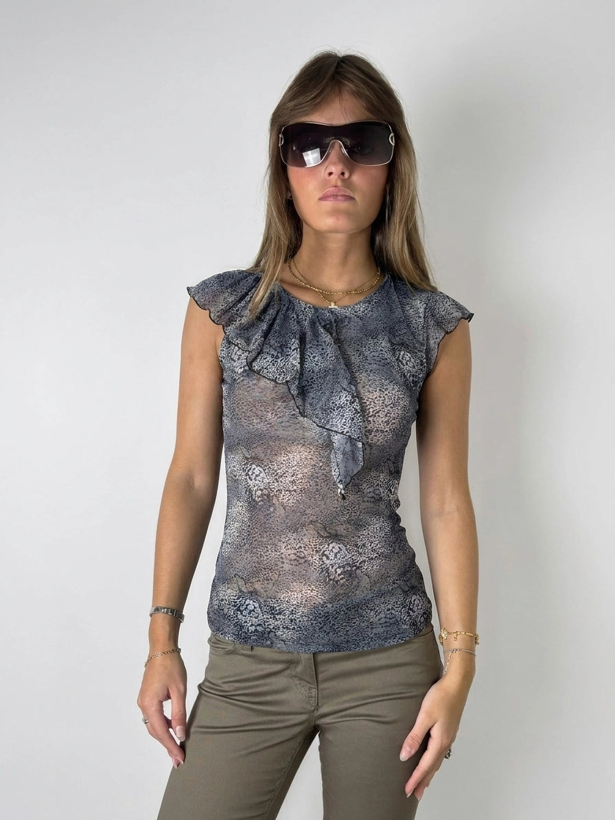Front view of a women's top in blue with ruffled neckline detail.