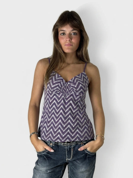 Front view of a women's purple chevron-patterned top with spaghetti straps.
