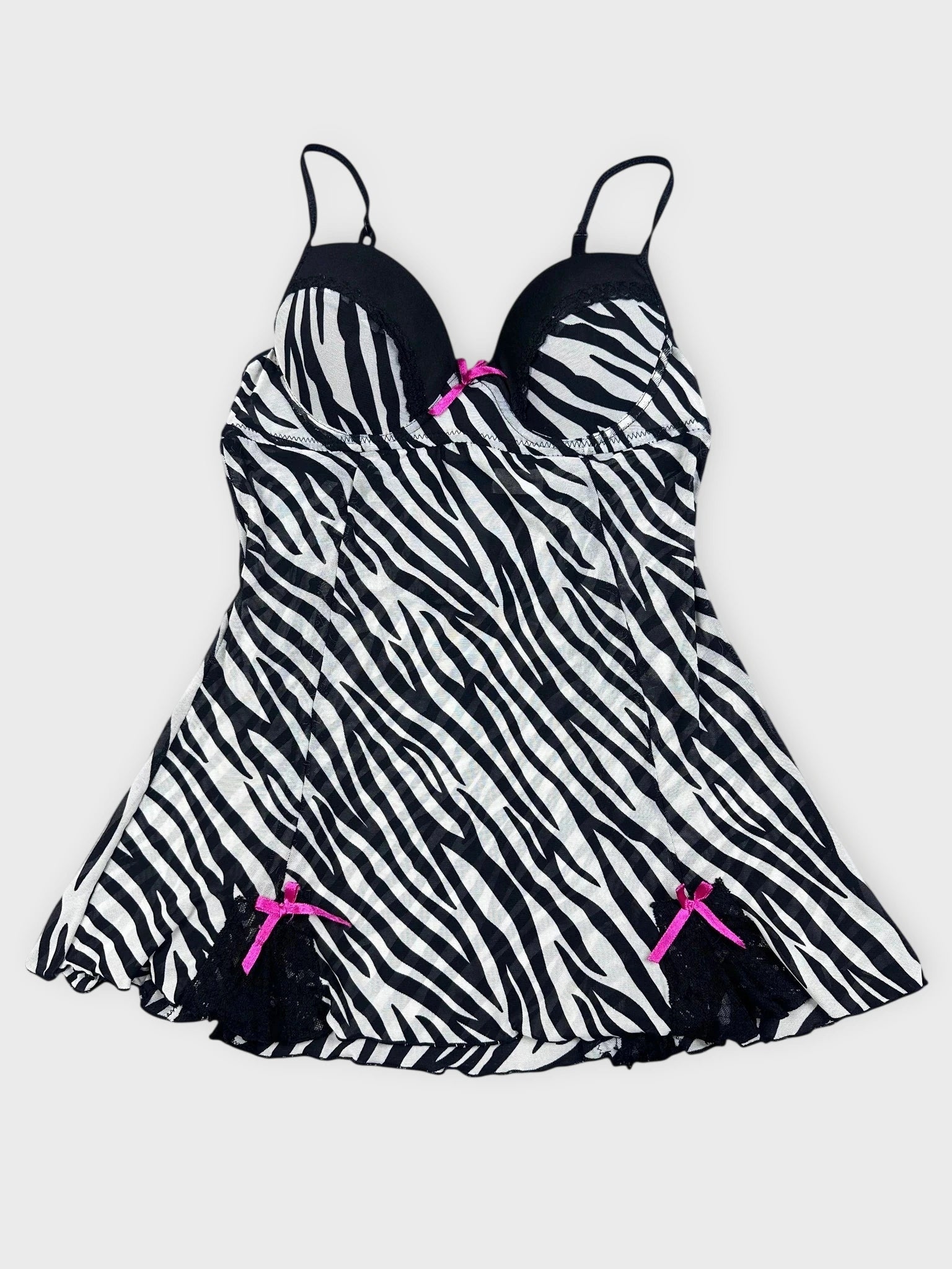 Zebra print swimsuit top with lace trim and pink bows front view